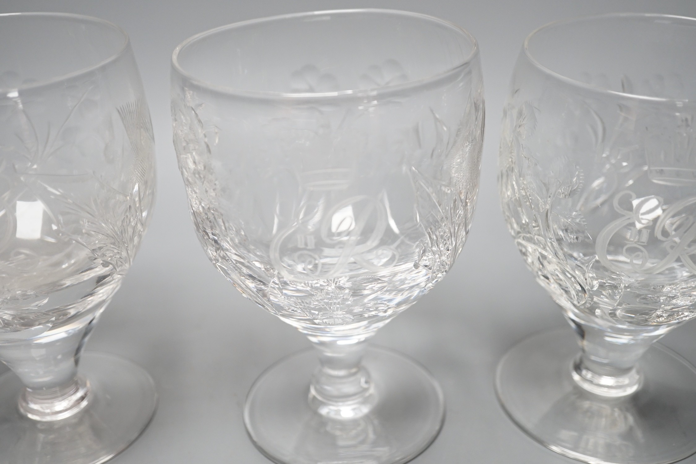 A set of four commemorative 1953 ER II coronation etched wine goblets, 14cms high